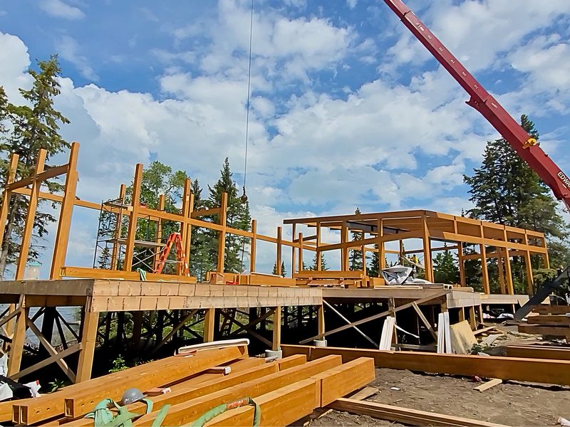 Timber frame raised by crane